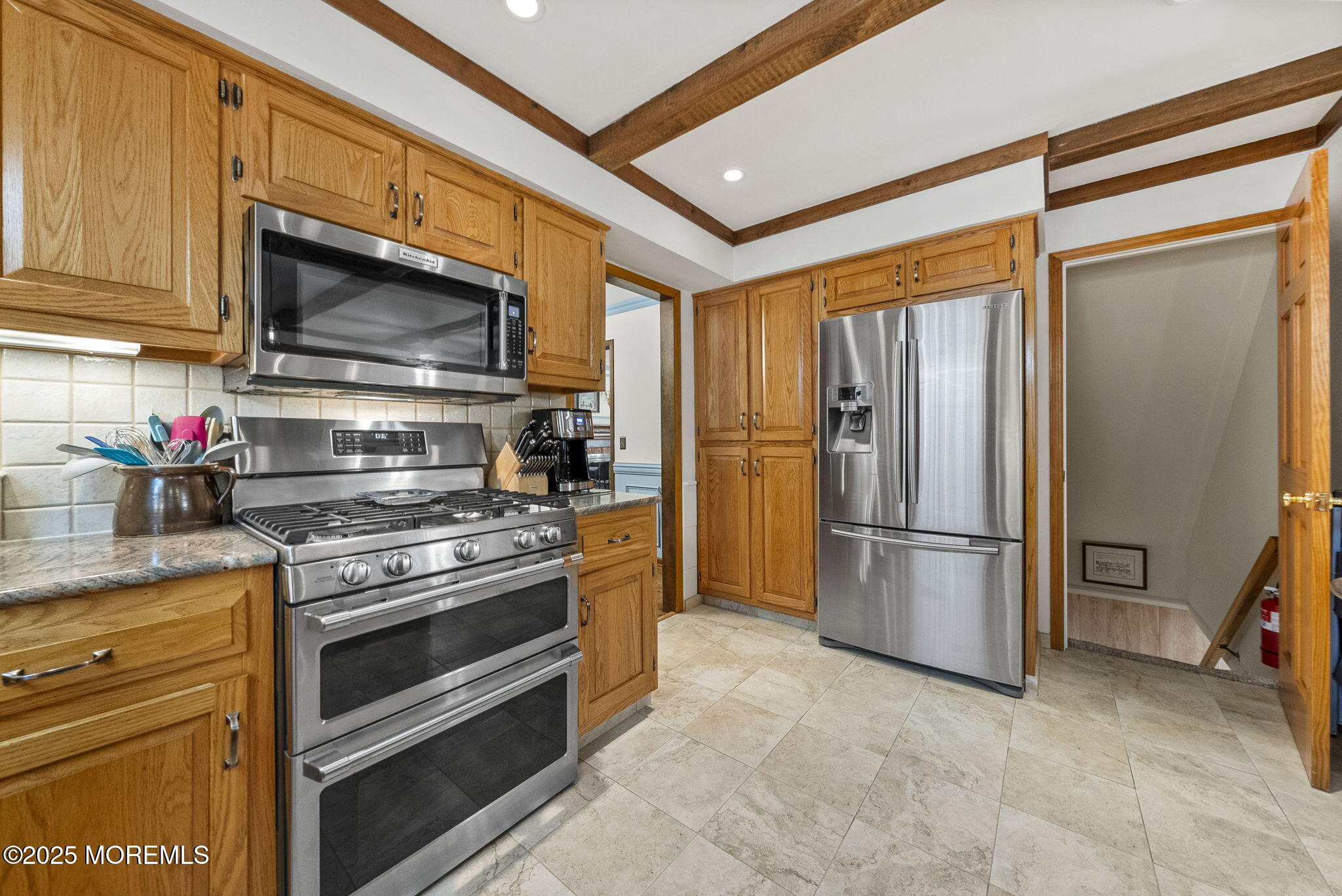 700 Rankin Road Brielle, NJ 08730 - Photo 16 of 59 a kitchen with stainless steel appliances granite countertop a refrigerator stove and microwave