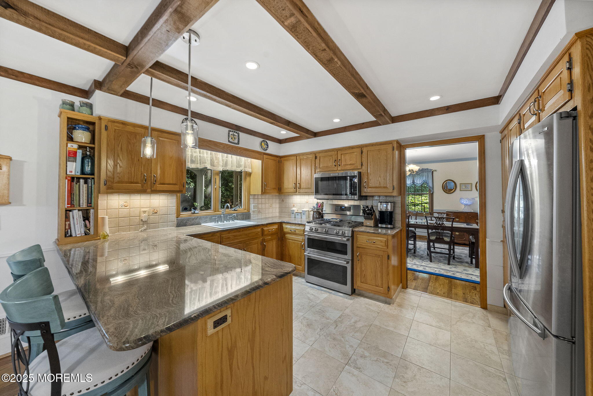 700 Rankin Road Brielle, NJ 08730 - Photo 17 of 59 a kitchen with stainless steel appliances granite countertop sink refrigerator and stove