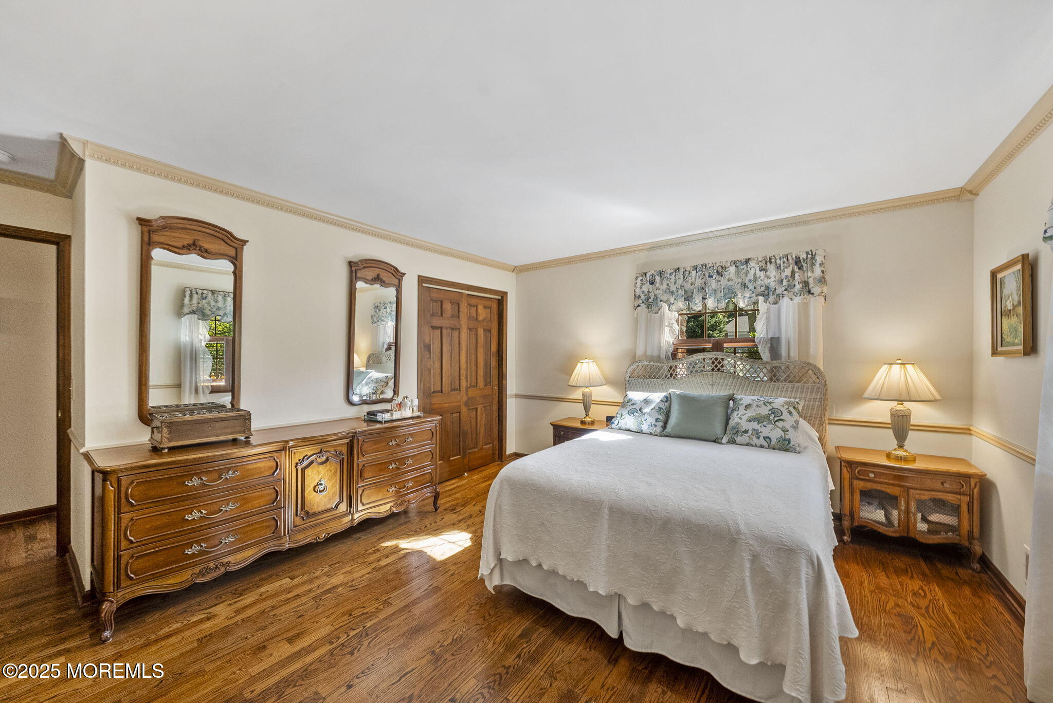 700 Rankin Road Brielle, NJ 08730 - Photo 27 of 59 a bedroom with a bed and wooden floor