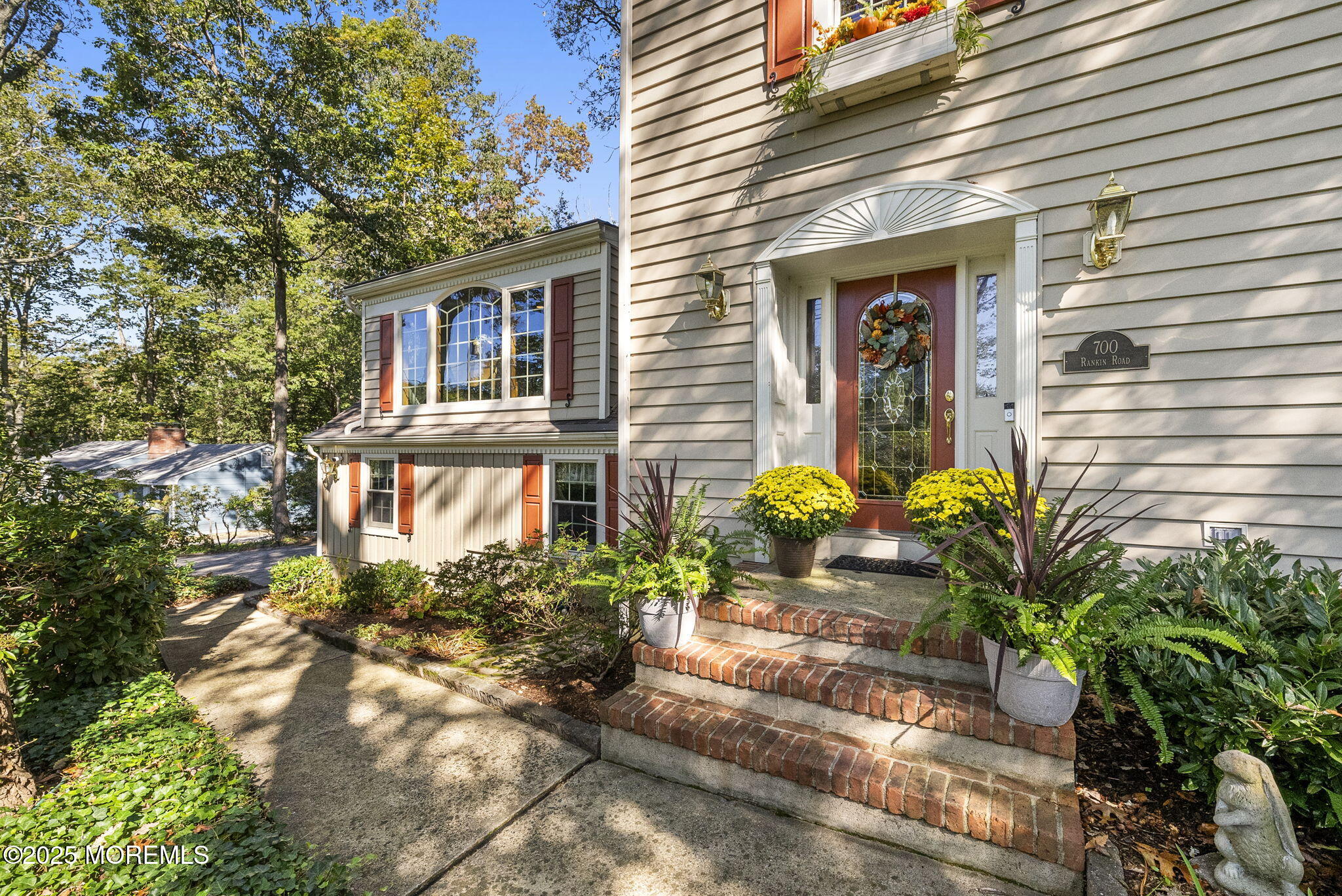 700 Rankin Road Brielle, NJ 08730 - Photo 3 of 59 a front view of a house with a yard