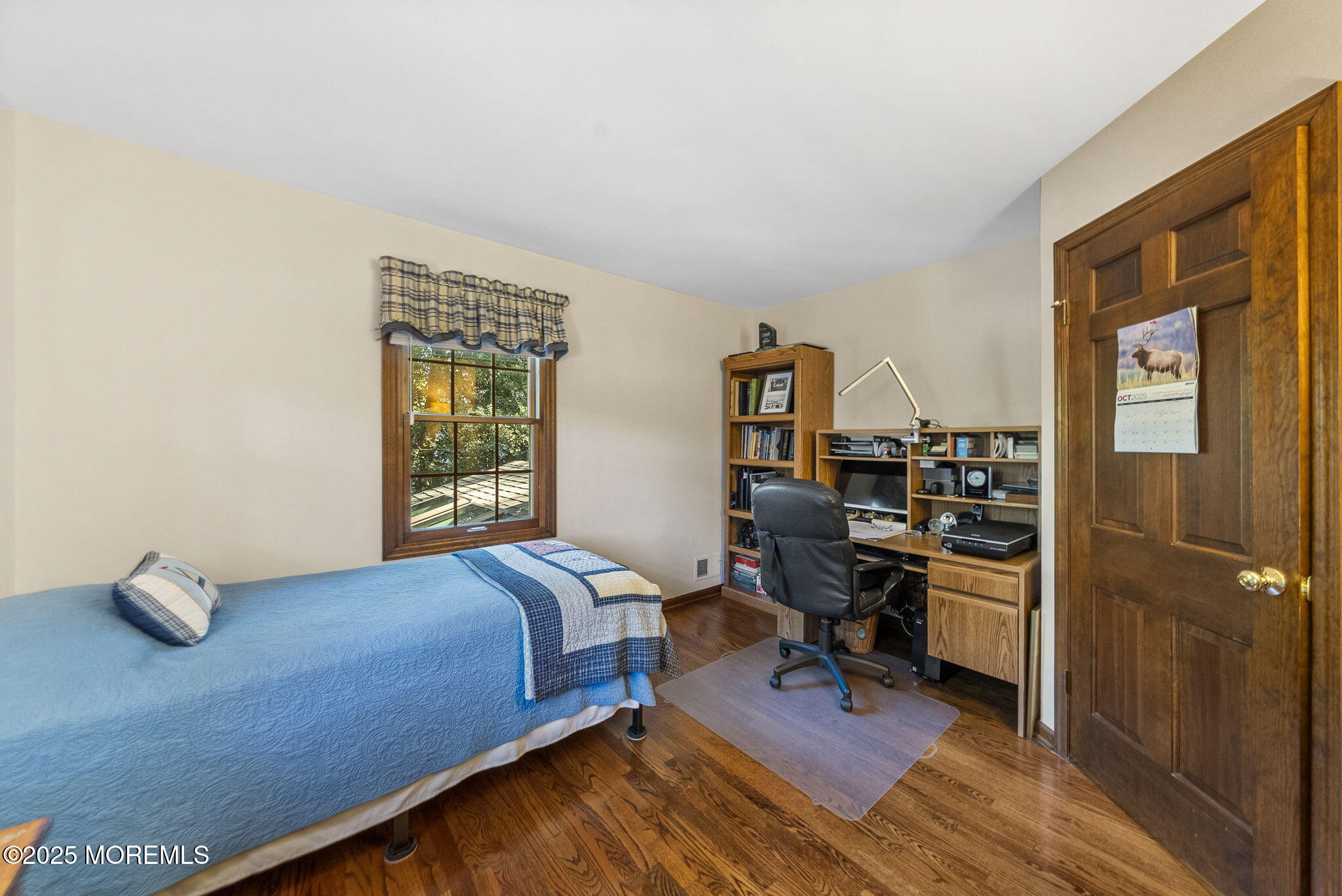 700 Rankin Road Brielle, NJ 08730 - Photo 31 of 59 a bedroom with a bed and wooden floor