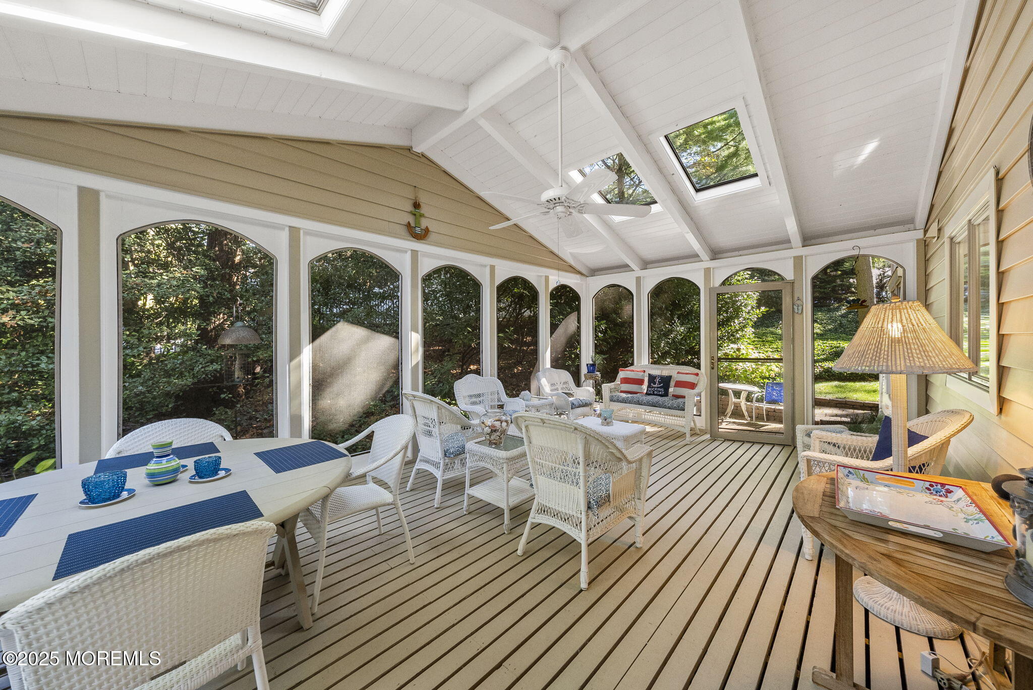 700 Rankin Road Brielle, NJ 08730 - Photo 40 of 59 a view of a dining room with furniture a chandelier and large windows