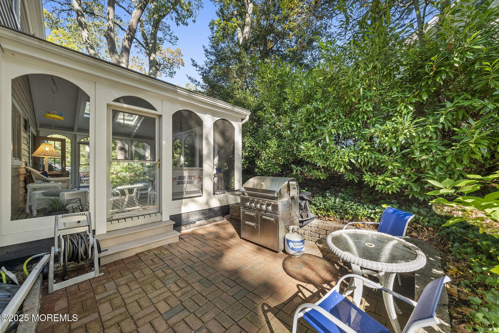 700 Rankin Road Brielle, NJ 08730 - Photo 45 of 59 a view of a patio with table and chairs and potted plants