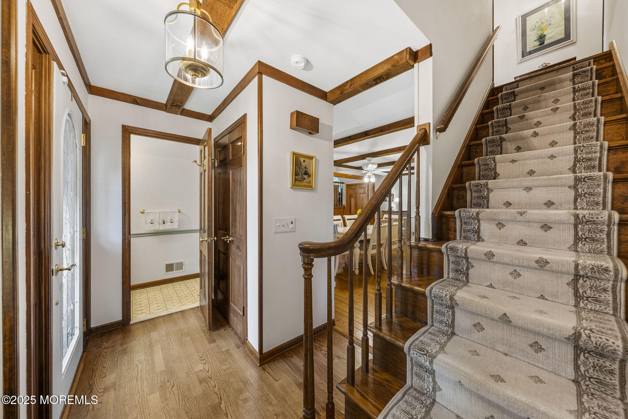 700 Rankin Road Brielle, NJ 08730 - Photo 7 of 59 a view of an entryway with wooden floor and staircase