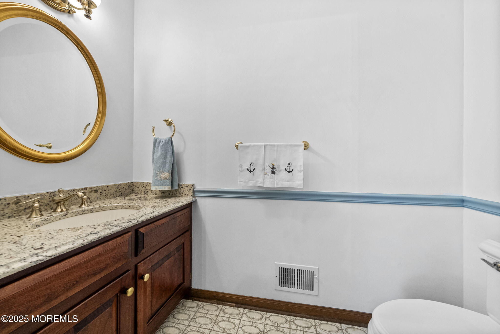 700 Rankin Road Brielle, NJ 08730 - Photo 8 of 59 a bathroom with a sink and a mirror