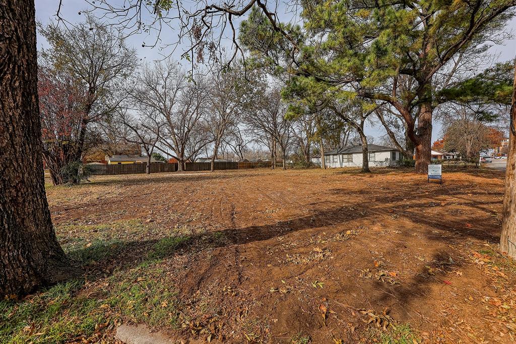 216 North Scott Street Burleson, TX 76028 - Photo 1 of 5 a view of dirt yard with a tree