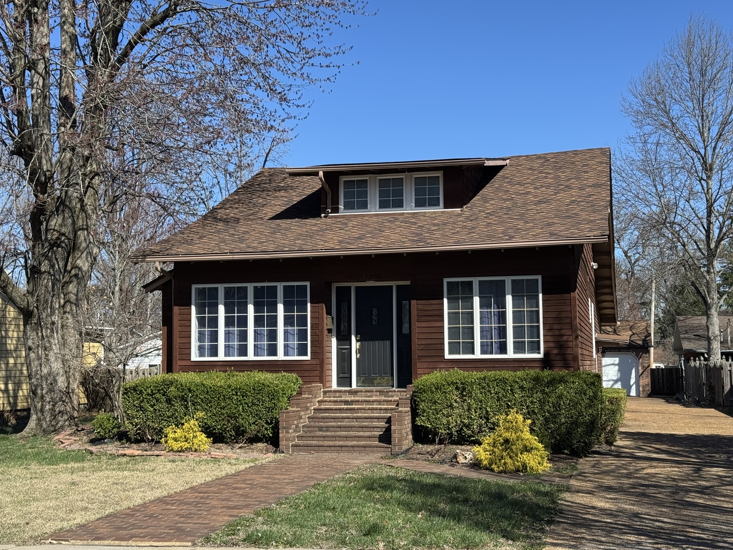 a front view of a house with a yard