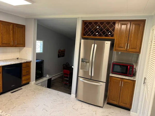 a kitchen with a refrigerator and a sink