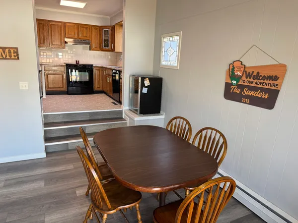 a dining room with furniture and window