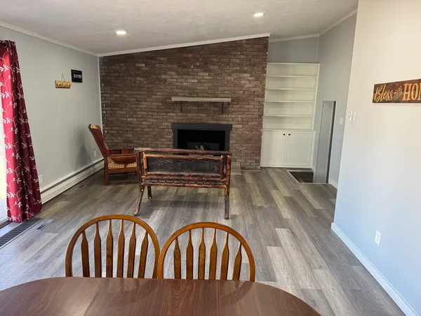 a view of a livingroom with furniture a fireplace