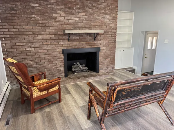 a bedroom with a bed and a fireplace