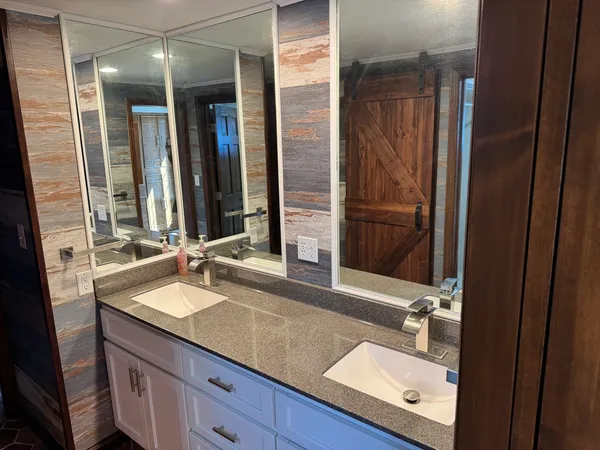 a bathroom with a sink and a mirror