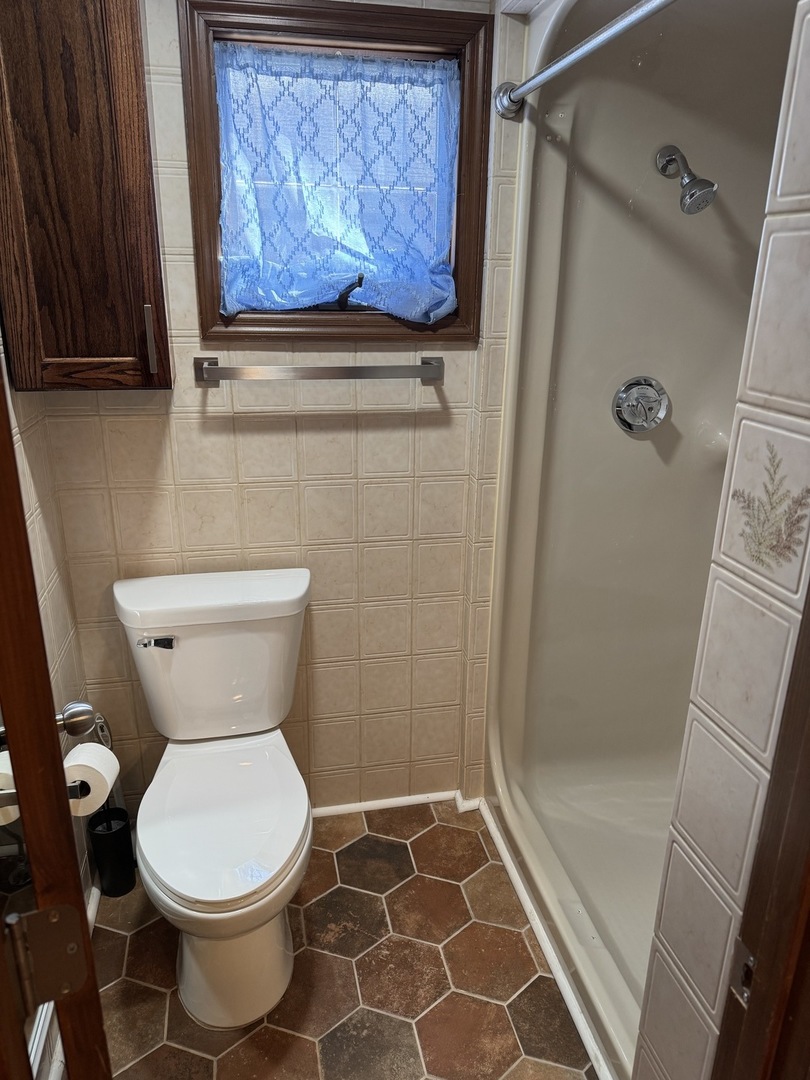 403 Mitchell Street Benton, IL 62812 - Photo 28 of 44 a bathroom with a toilet and a shower