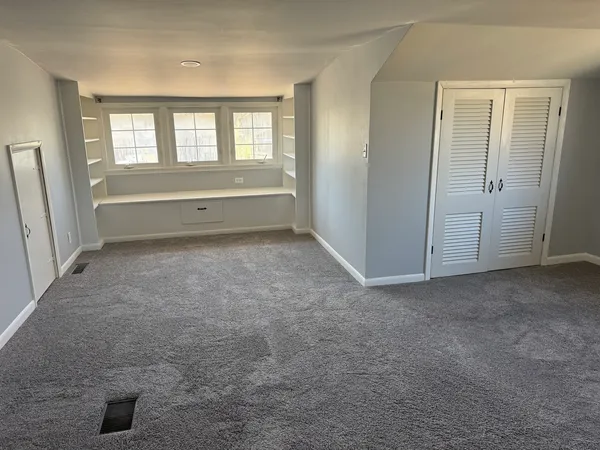 an empty room with windows