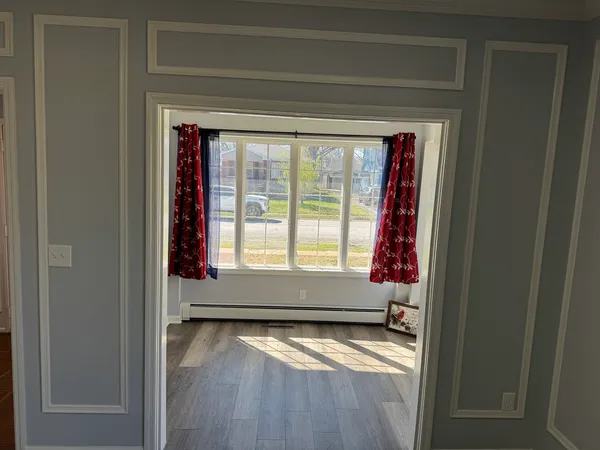 a view of an empty room with a window
