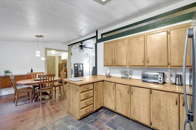 a kitchen with lots of counter top space and dining table