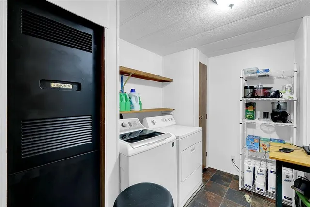 a view of kitchen and cabinets