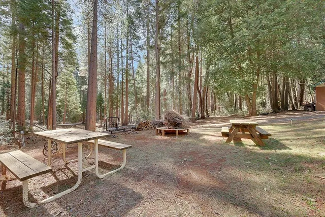 a view of a patio with a table and chairs and couches
