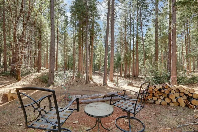 a view of swimming pool with outdoor seating