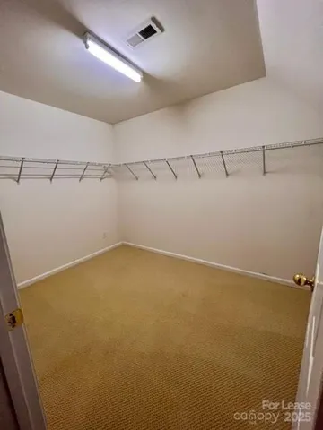 a view of a room with racks on the wall