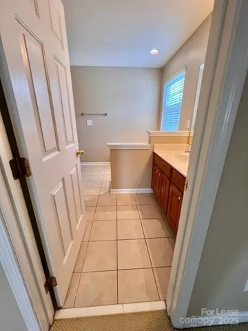 a view of bathroom with toilet and window