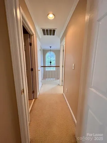 a view of a hallway view with staircase