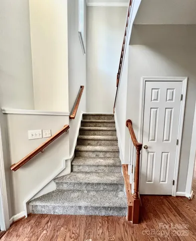 a view of entryway with wooden floor