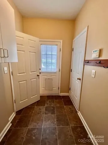 a view of a storage & utility room with a sink
