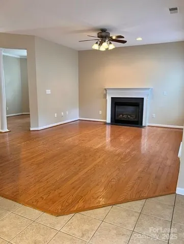 a view of an empty room with a fireplace