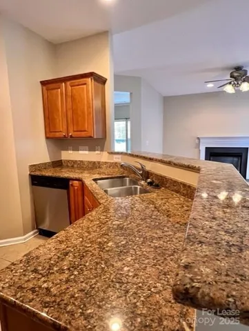 a view of a kitchen with a sink and cabinets