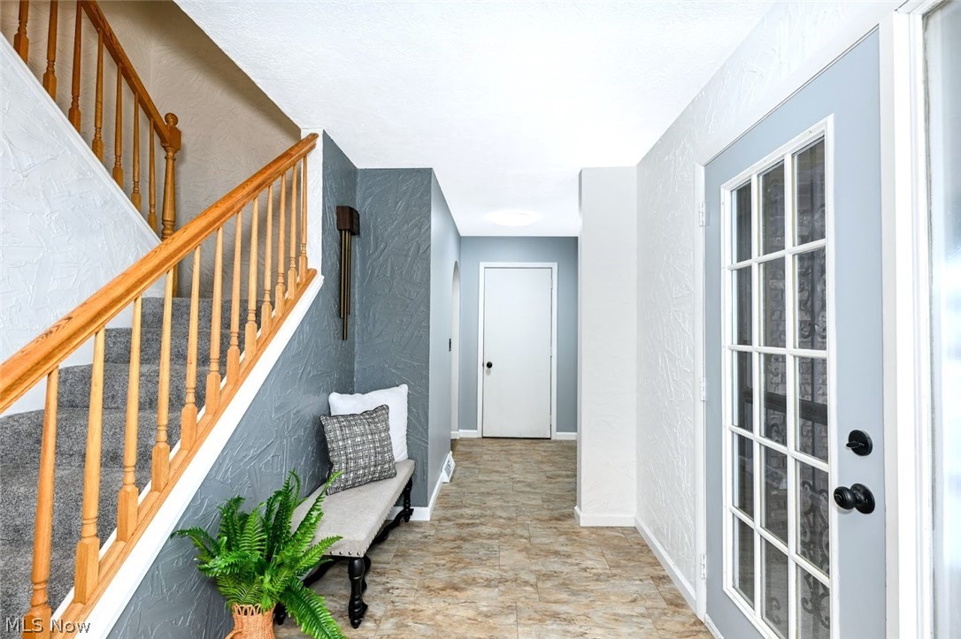 6151 Taylor Road Clinton, OH 44216 - Photo 28 of 49 *FRONT ENTRYWAY. NOTE: FULL BATHROOM AND MUDROOM ARE DOWN THIS HALLWAY