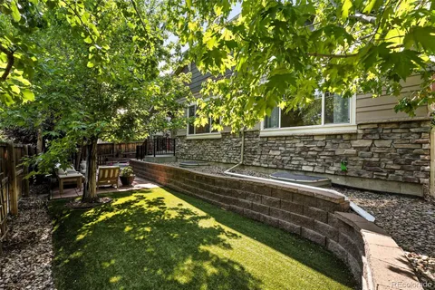 a view of yard with swimming pool and sitting area
