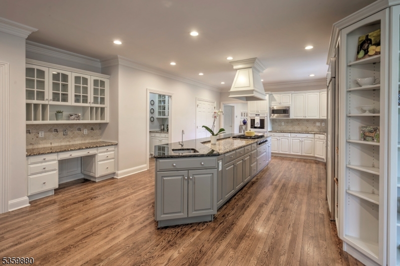 51 Post Kennel Road Bernardsville, NJ 07924 - Photo 11 of 43 a kitchen with stainless steel appliances a stove top oven and cabinets