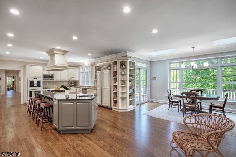 51 Post Kennel Road Bernardsville, NJ 07924 - Photo 12 of 43 a living room with stainless steel appliances granite countertop furniture wooden floor and a large window
