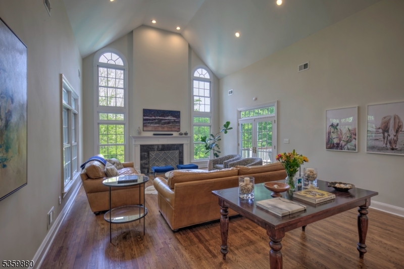 51 Post Kennel Road Bernardsville, NJ 07924 - Photo 15 of 43 a living room with furniture a fireplace and a large window