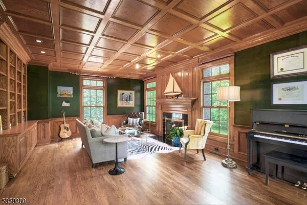 a living room with furniture a fireplace and a table