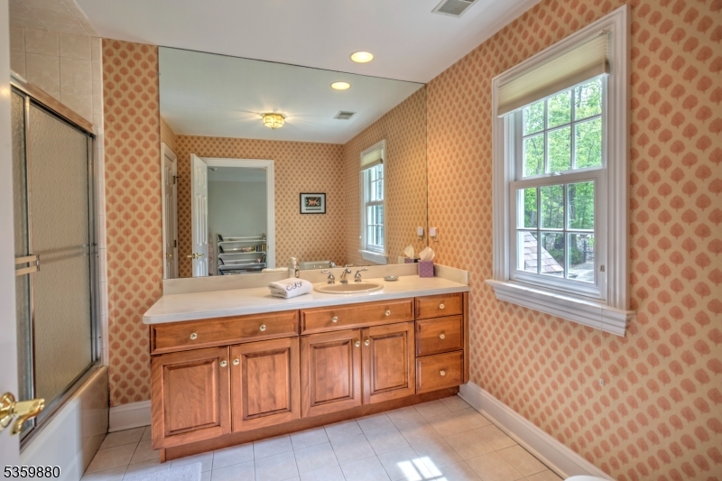51 Post Kennel Road Bernardsville, NJ 07924 - Photo 31 of 43 a bathroom with a sink a vanity and a mirror
