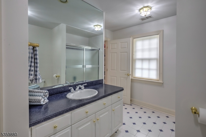 51 Post Kennel Road Bernardsville, NJ 07924 - Photo 33 of 43 a bathroom with a sink double vanity and a mirror