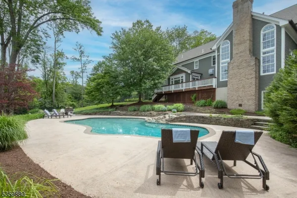 a view of house with yard outdoor seating and entertaining space
