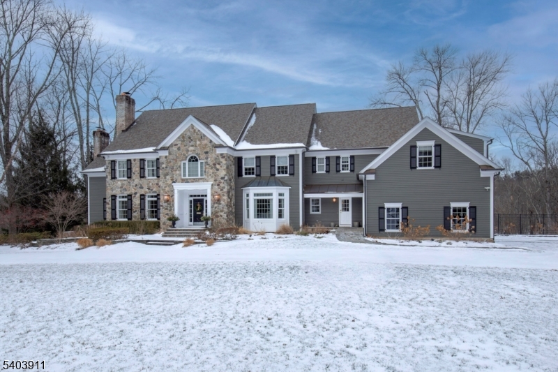 51 Post Kennel Road Bernardsville, NJ 07924 - Photo 5 of 48 a front view of a house with a yard covered in snow