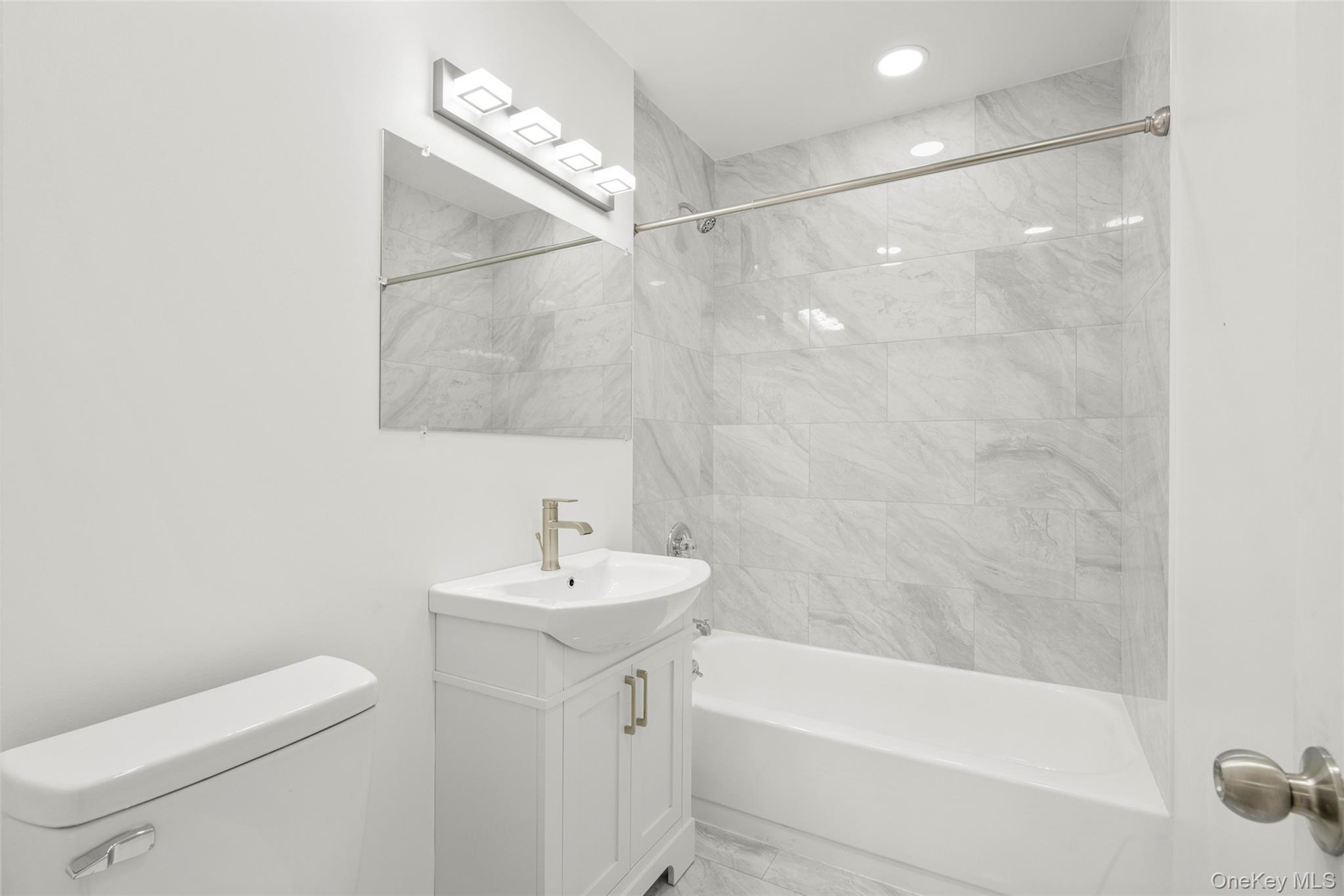 179 Drake Avenue, Unit 2J New Rochelle, NY 10805 - Photo 8 of 16 Bathroom with vanity and bathing tub / shower combination