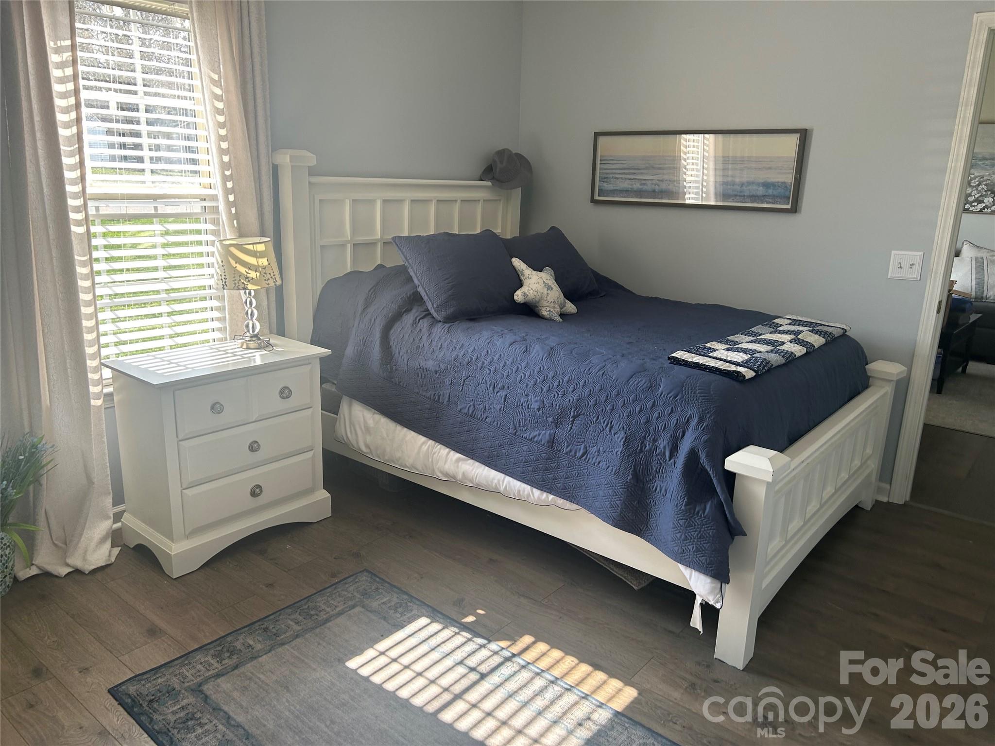 110 Shenandoah Loop Troutman, NC 28166 - Photo 21 of 24 a bedroom with a bed and window