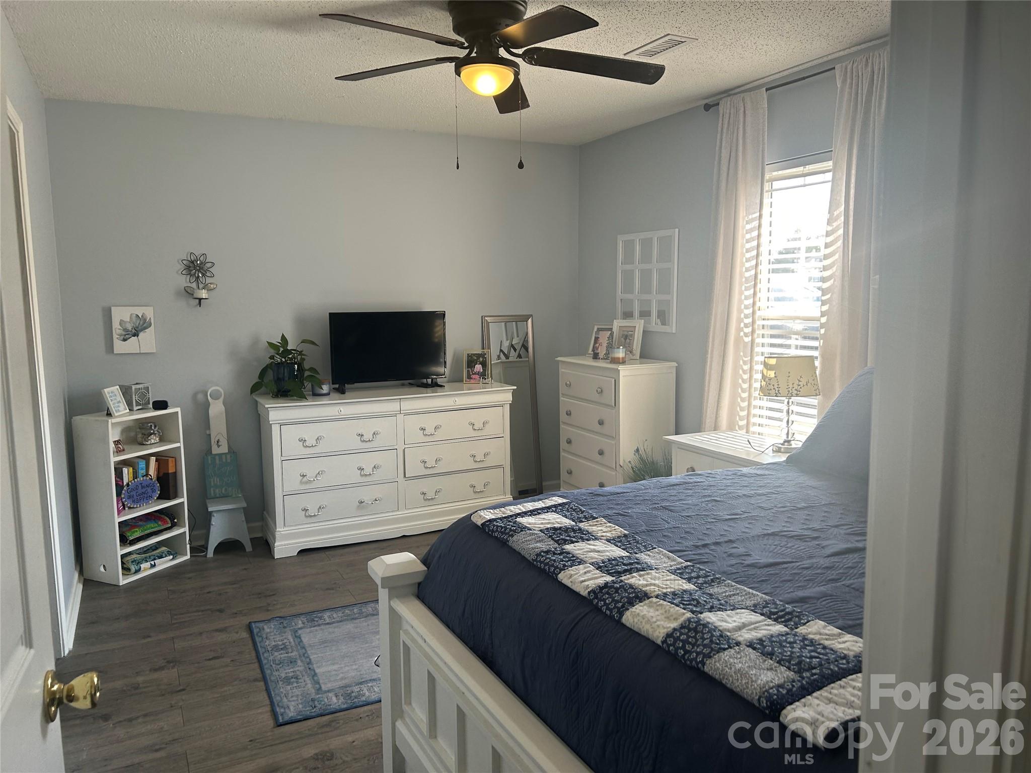 110 Shenandoah Loop Troutman, NC 28166 - Photo 22 of 24 a bedroom with a bed and furniture