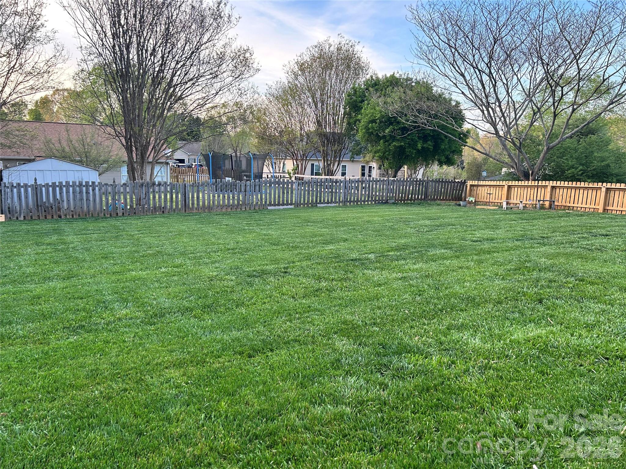 110 Shenandoah Loop Troutman, NC 28166 - Photo 5 of 24 a view of a park with large trees