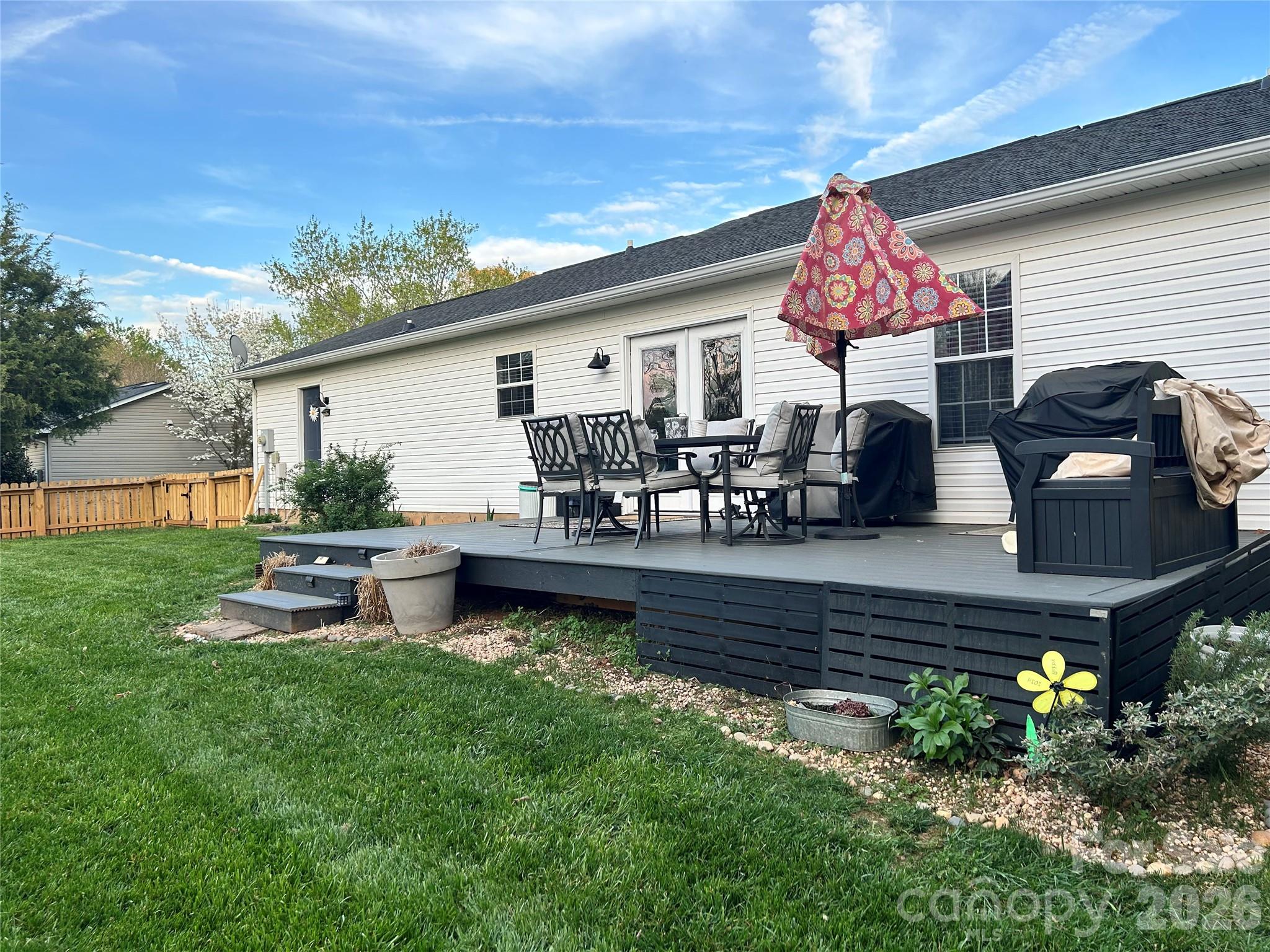 110 Shenandoah Loop Troutman, NC 28166 - Photo 6 of 24 a view of a house with back yard
