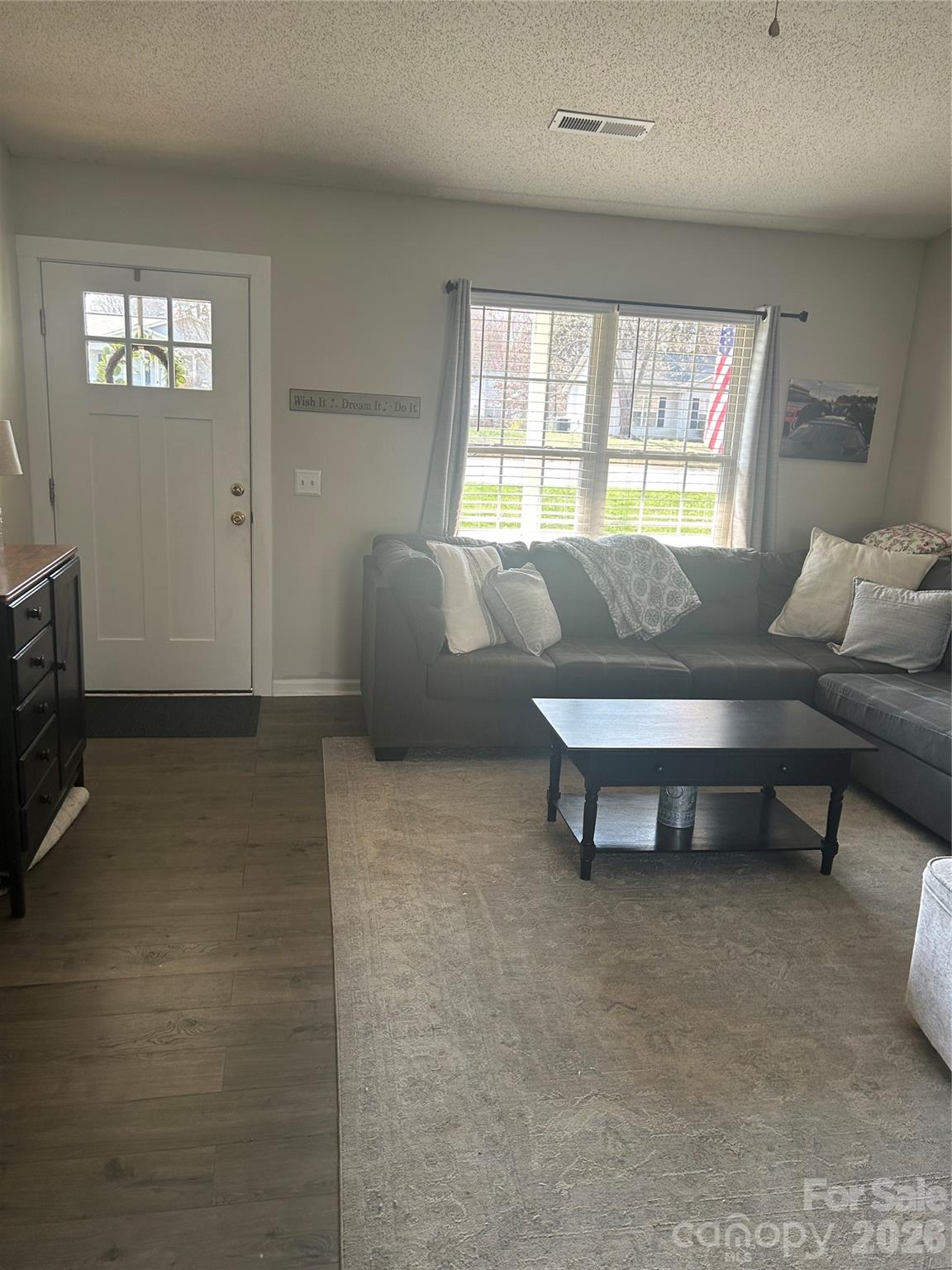 110 Shenandoah Loop Troutman, NC 28166 - Photo 7 of 24 a living room with furniture and a window