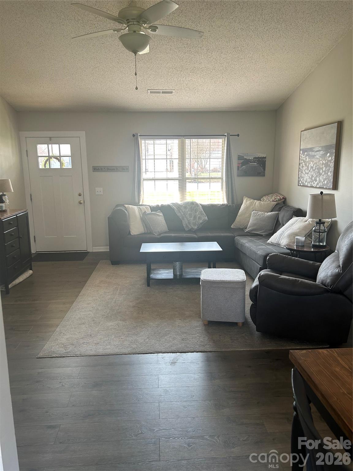 110 Shenandoah Loop Troutman, NC 28166 - Photo 8 of 24 a living room with furniture and a window