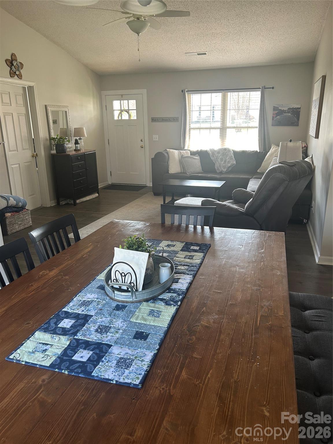 110 Shenandoah Loop Troutman, NC 28166 - Photo 10 of 24 a living room with furniture and a flat screen tv
