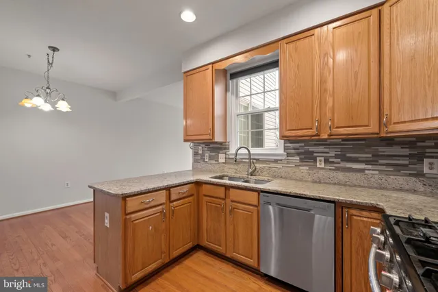 a kitchen with sink cabinets and window