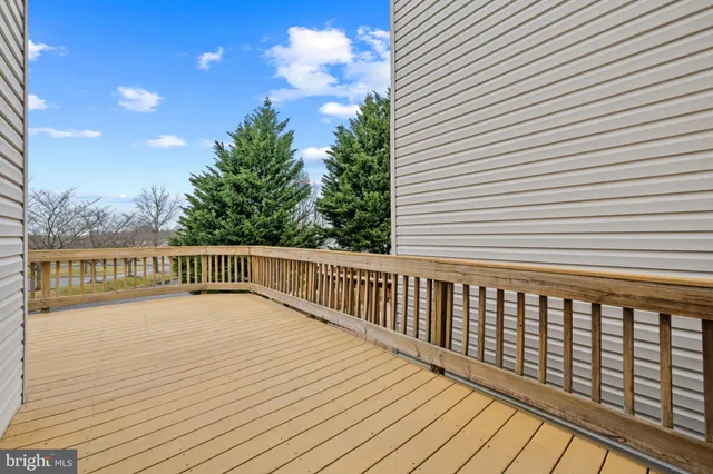 a view of balcony with wooden floor